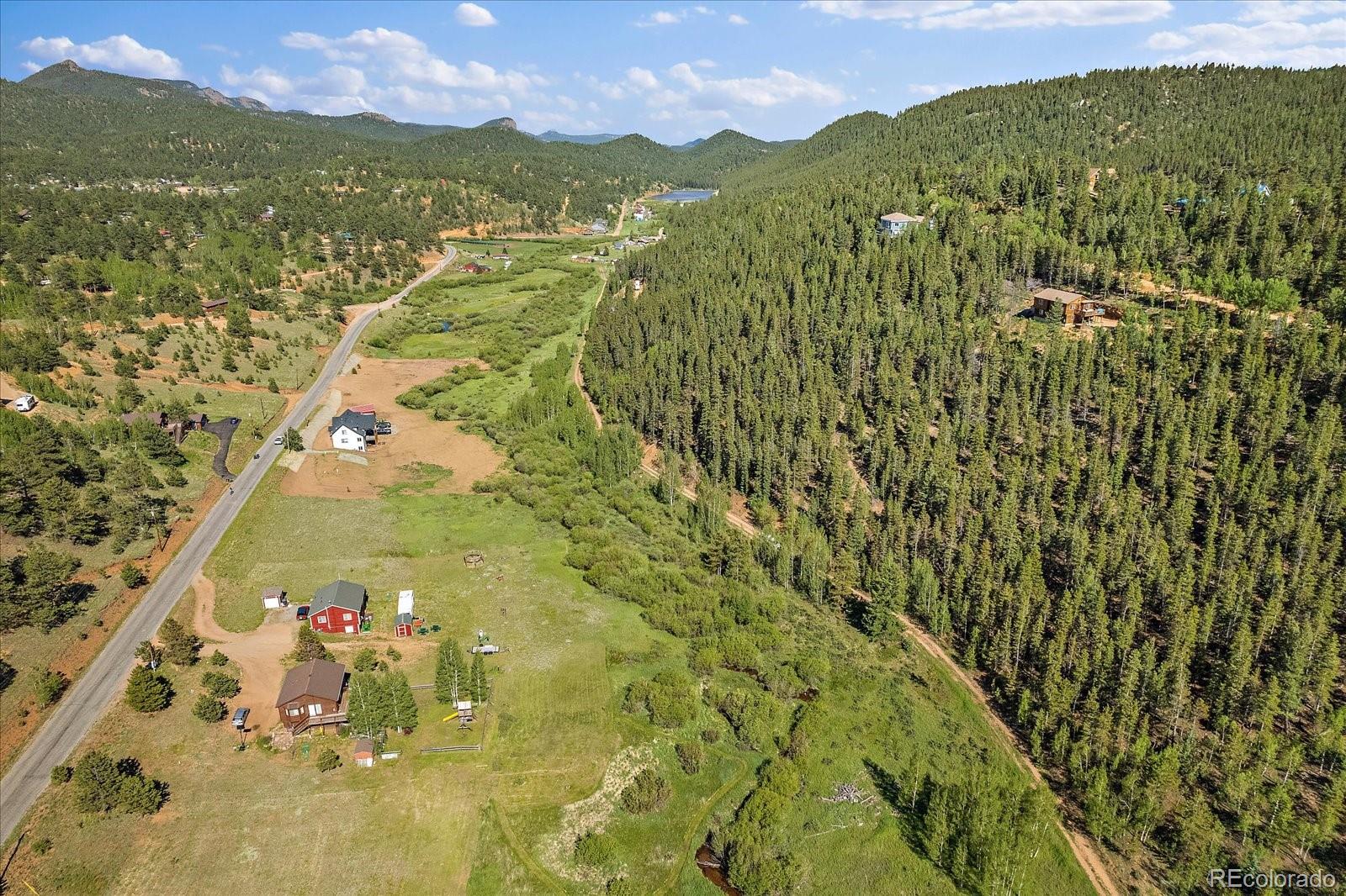 454 Smith Road Bailey, CO 80421 - Photo 14 of 24 a view of lake and mountain