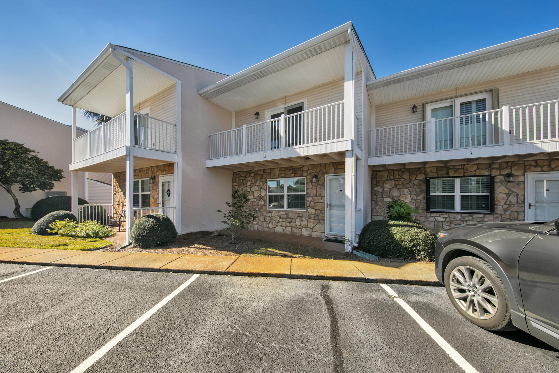241 Ellis Road, Unit 4 Miramar Beach, FL 32550 - Photo 2 of 30 a view of a house with a patio