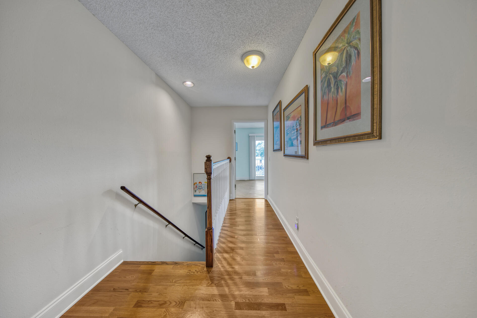 241 Ellis Road, Unit 4 Miramar Beach, FL 32550 - Photo 17 of 30 a view of a hallway with wooden floor