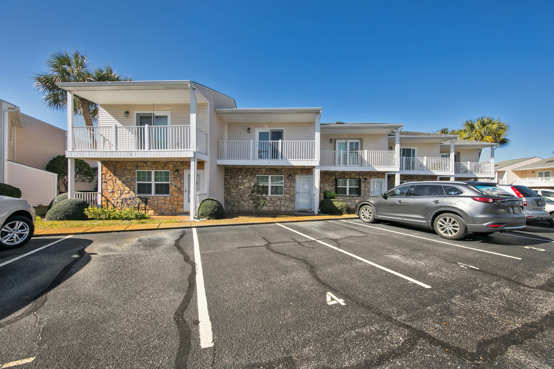 241 Ellis Road, Unit 4 Miramar Beach, FL 32550 - Photo 3 of 30 a view of a car park in front of a house