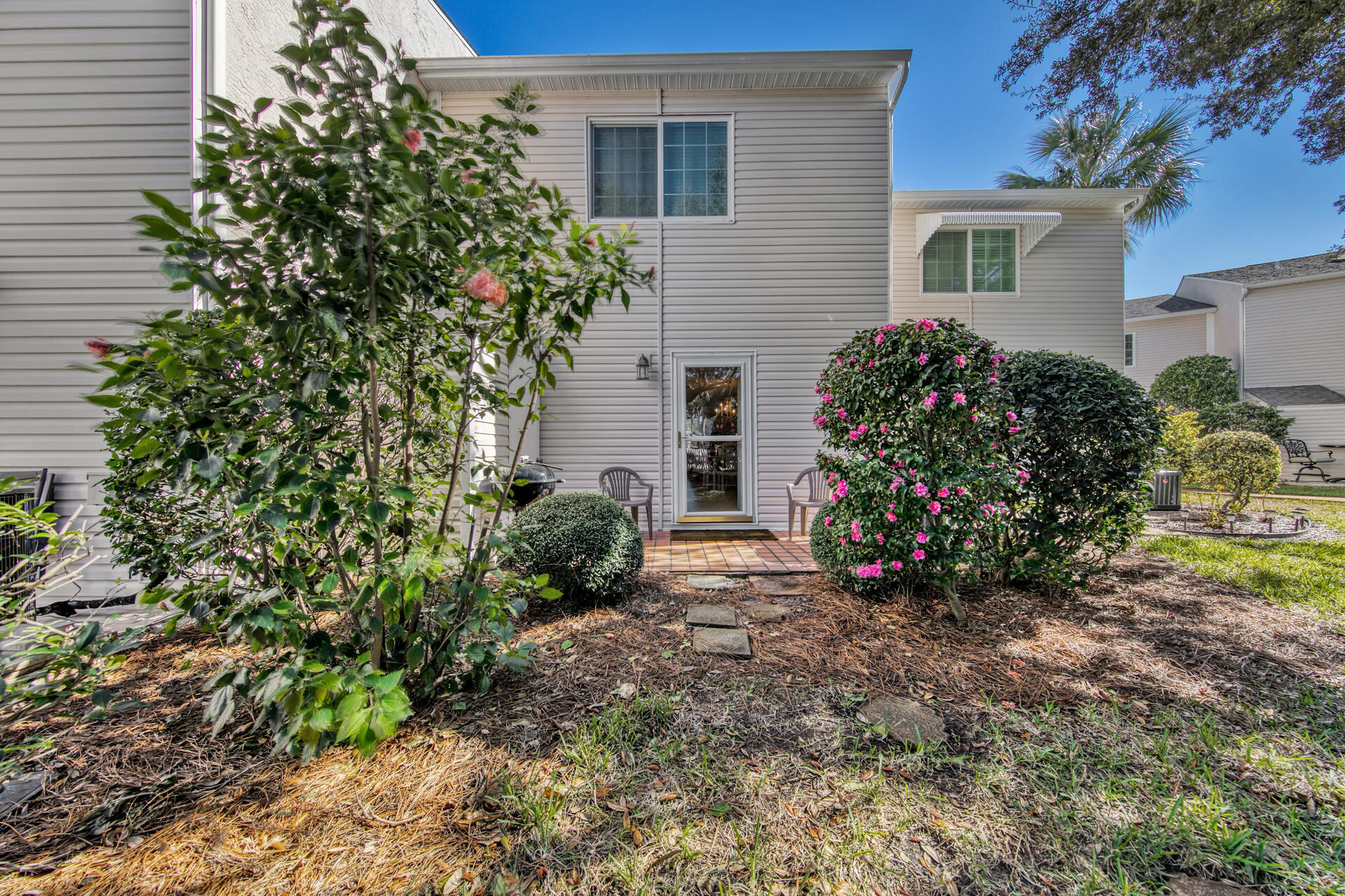 241 Ellis Road, Unit 4 Miramar Beach, FL 32550 - Photo 22 of 30 a view of a house with a flower garden