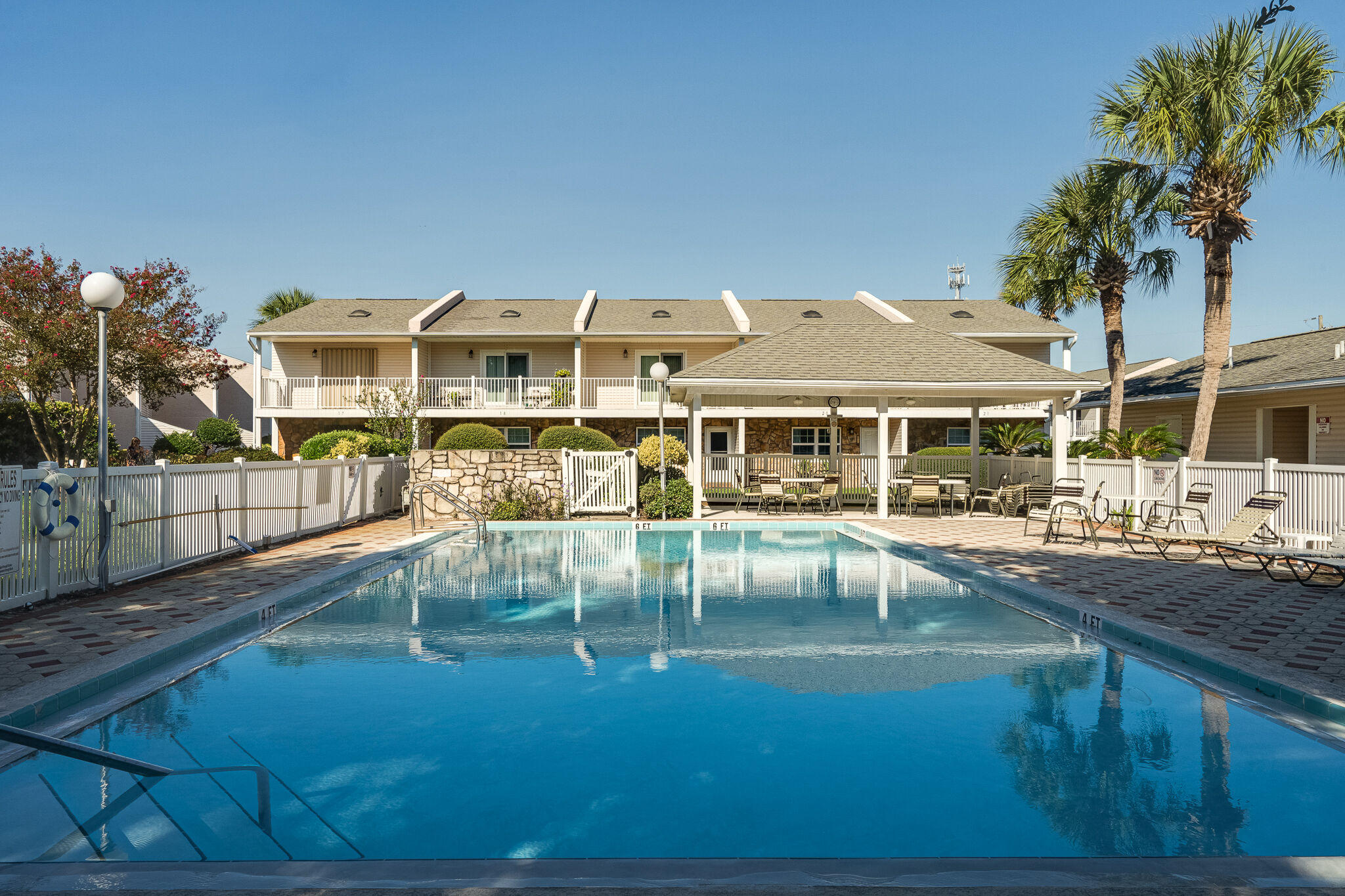 241 Ellis Road, Unit 4 Miramar Beach, FL 32550 - Photo 25 of 30 a view of a house with swimming pool