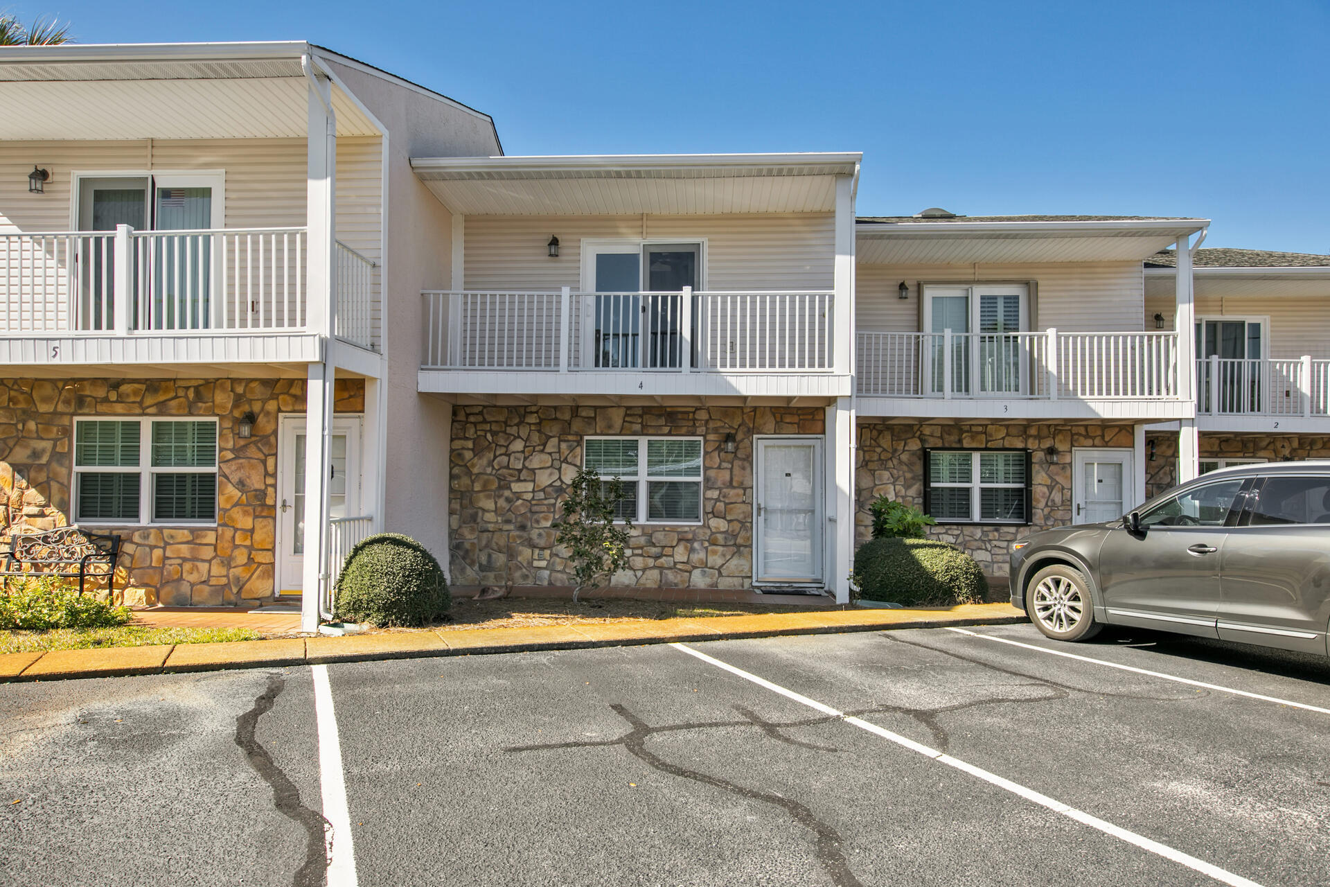 241 Ellis Road, Unit 4 Miramar Beach, FL 32550 - Photo 4 of 30 a front view of a house with a parking space