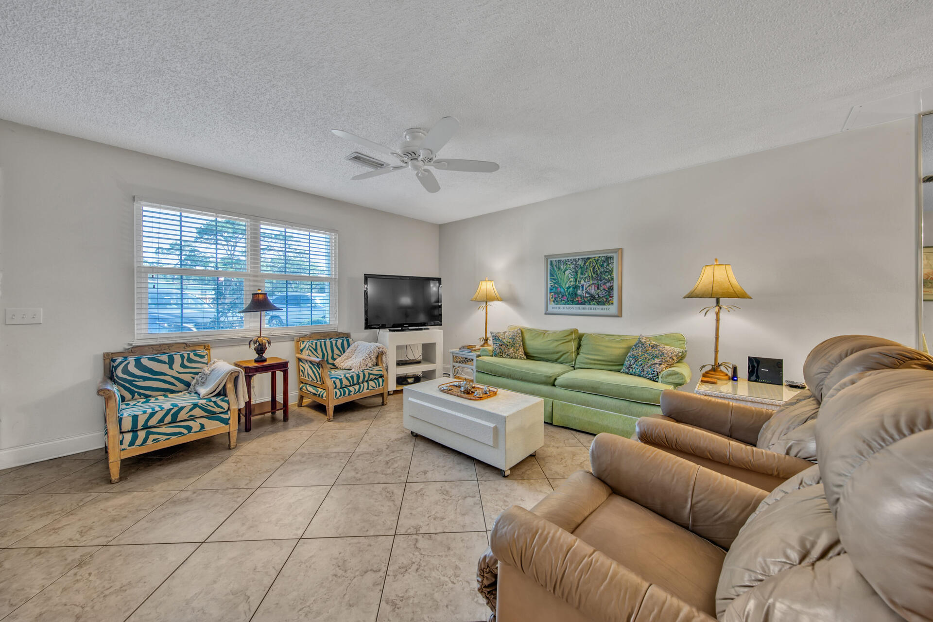 241 Ellis Road, Unit 4 Miramar Beach, FL 32550 - Photo 5 of 30 a living room with furniture a flat screen tv and a window
