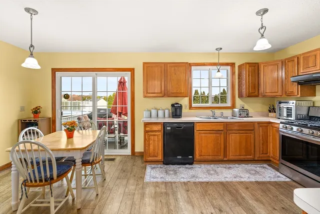 a view of a dining room with furniture and a window