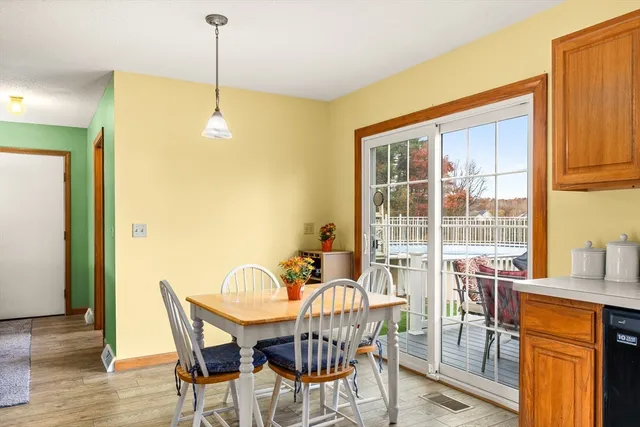 a dining room with furniture and window
