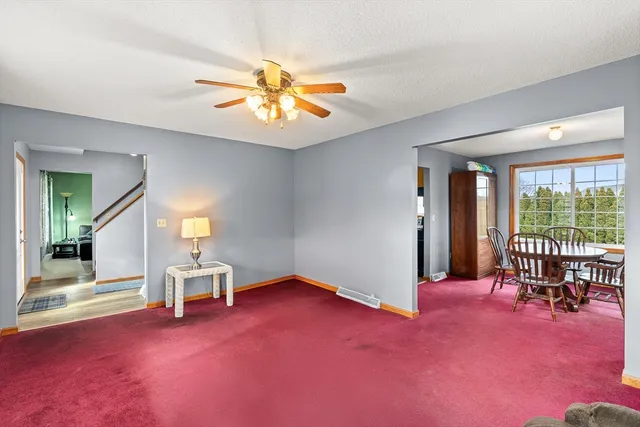 a view of an entryway with wooden floor