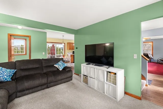a living room with furniture and a rug