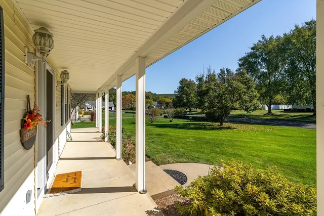 a view of a patio with table and chairs and potted plants