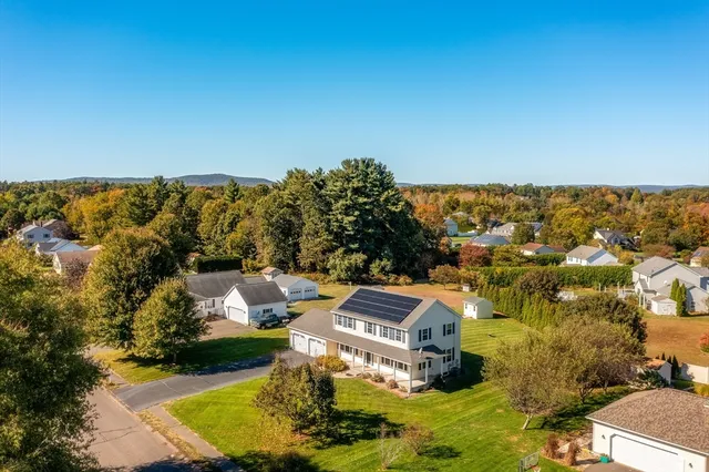 an aerial view of residential houses with outdoor space