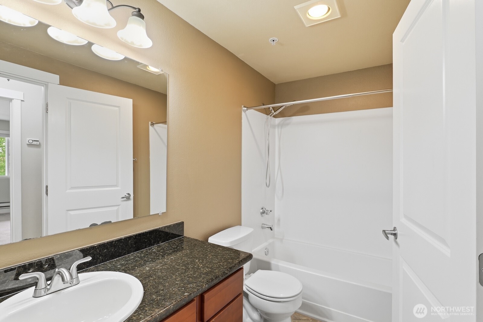 16409 Currie Road Southeast, Unit A308 Monroe, WA 98272 - Photo 13 of 21 a bathroom with a granite countertop sink toilet and shower
