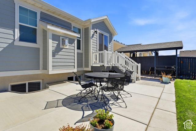 986 South Old Farm Road Heber City, UT 84032 - Photo 49 of 51 Concrete patio with a covered outdoor structure, exterior siding, and white window trim