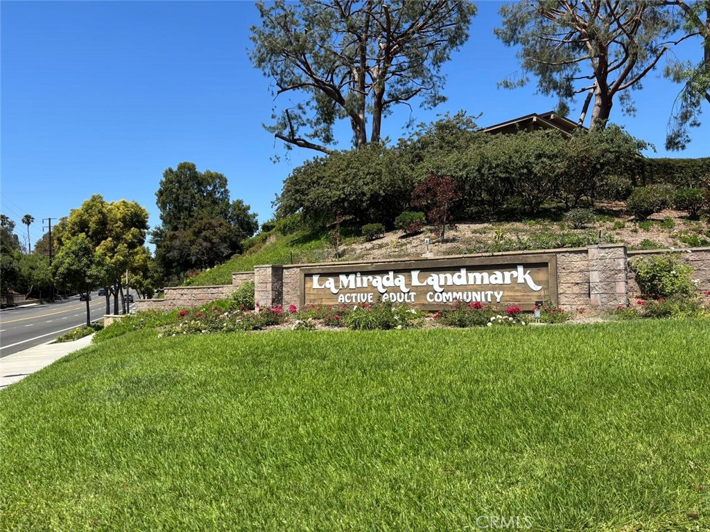 13634 La Jolla Circle, Unit 13E La Mirada, CA 90638 - Photo 1 of 32 a view of a big yard with potted plants and large trees