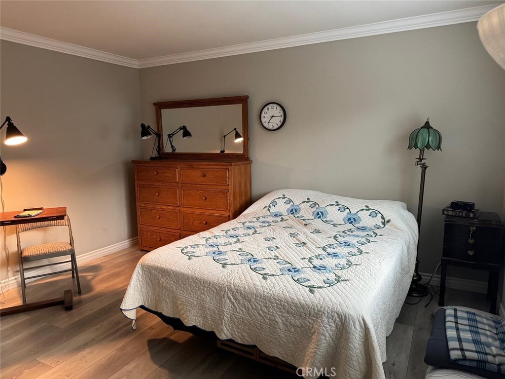 13634 La Jolla Circle, Unit 13E La Mirada, CA 90638 - Photo 11 of 32 a bedroom with a bed and a dresser