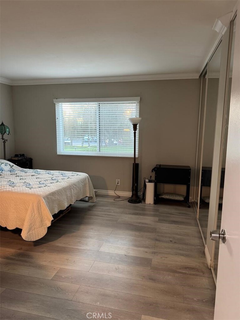 13634 La Jolla Circle, Unit 13E La Mirada, CA 90638 - Photo 12 of 32 a bedroom with a bed and a view of en suite bathroom