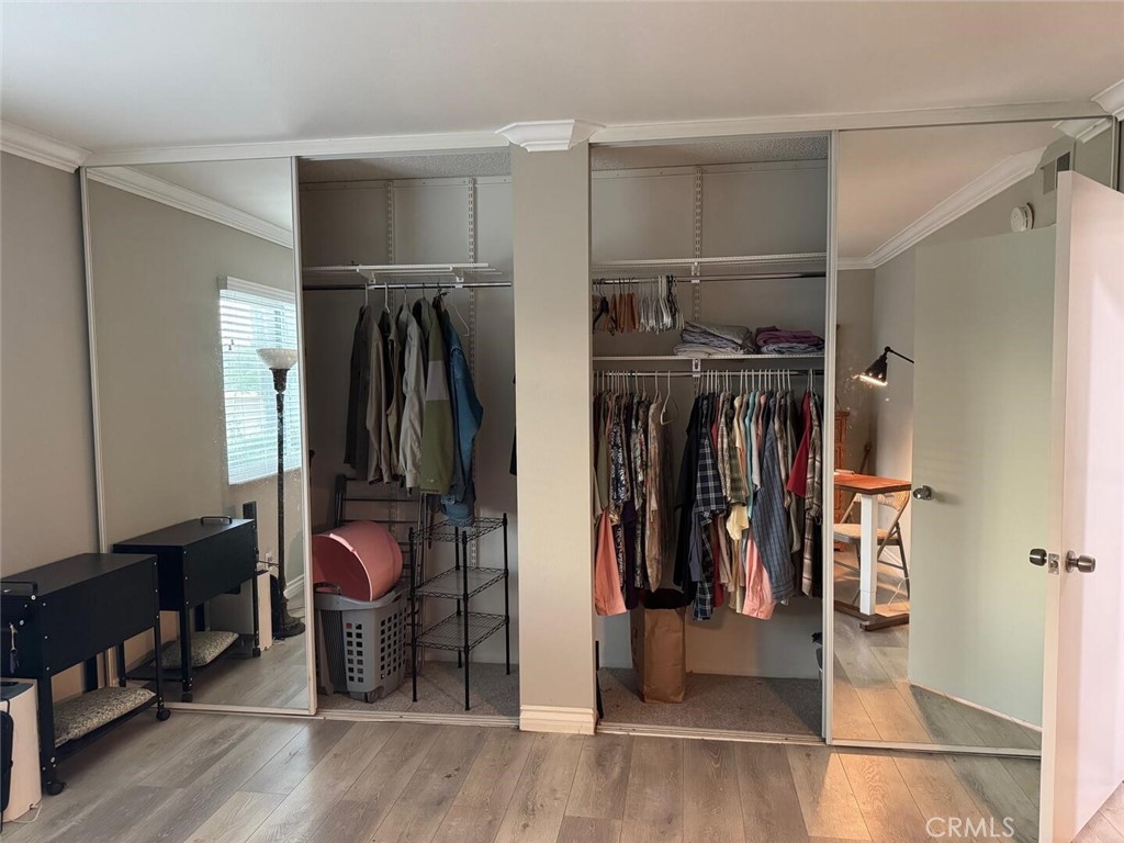 13634 La Jolla Circle, Unit 13E La Mirada, CA 90638 - Photo 13 of 32 a view of walk in closet with clothes and shoes