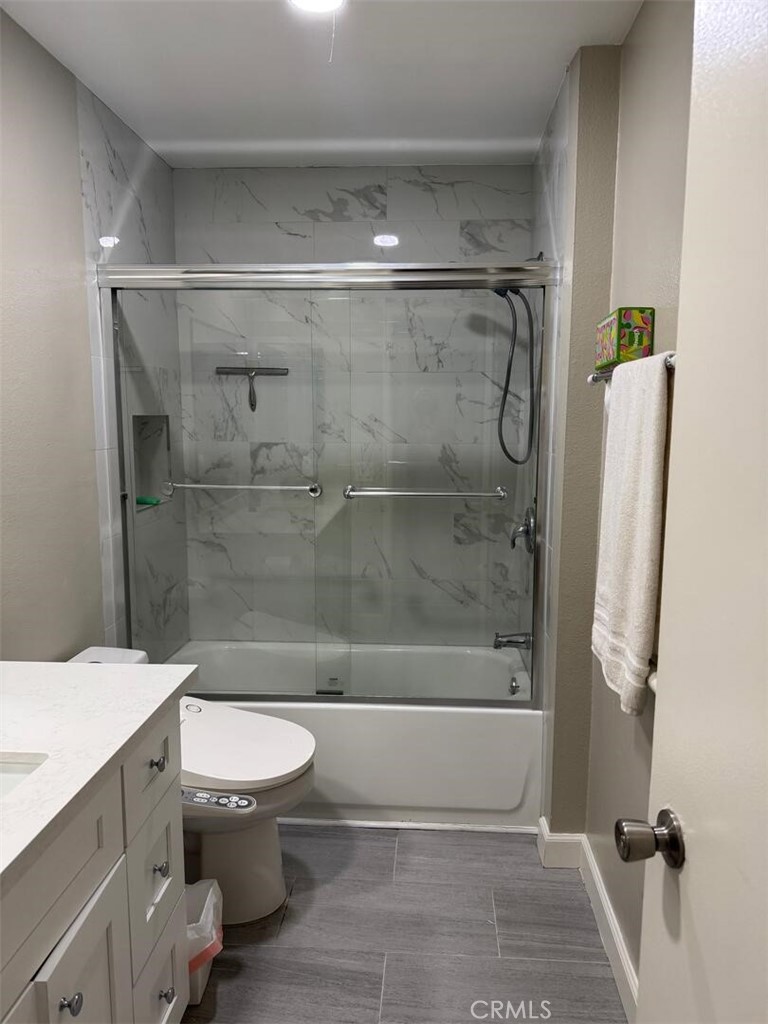 13634 La Jolla Circle, Unit 13E La Mirada, CA 90638 - Photo 16 of 32 a bathroom with a shower a toilet and a sink