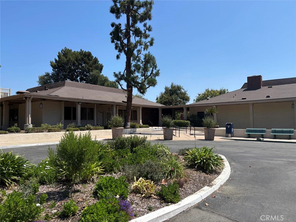 13634 La Jolla Circle, Unit 13E La Mirada, CA 90638 - Photo 20 of 32 a front view of house with yard and outdoor seating