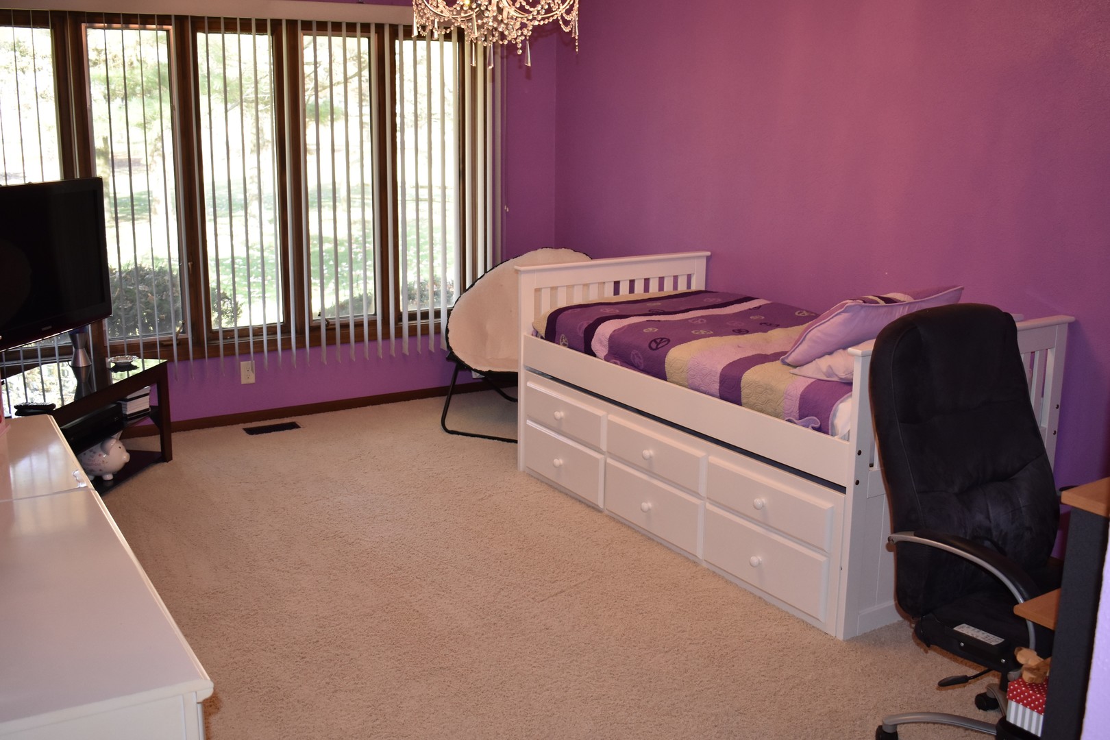 1413 East 550th Road Lostant, IL 61334 - Photo 12 of 37 a bedroom with furniture and a flat screen tv