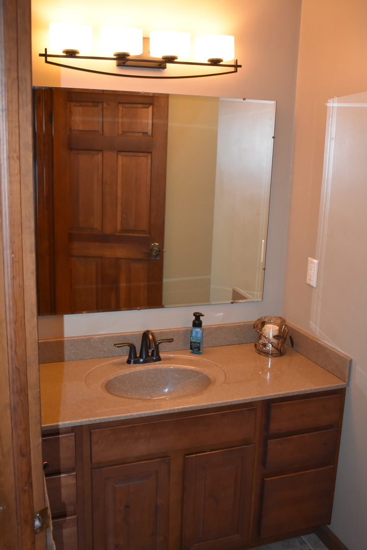 1413 East 550th Road Lostant, IL 61334 - Photo 14 of 37 a bathroom with a sink and a mirror