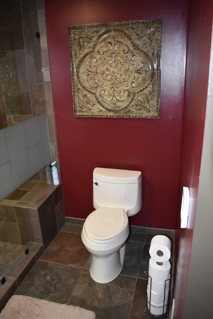 1413 East 550th Road Lostant, IL 61334 - Photo 18 of 37 a white toilet sitting next to a shower