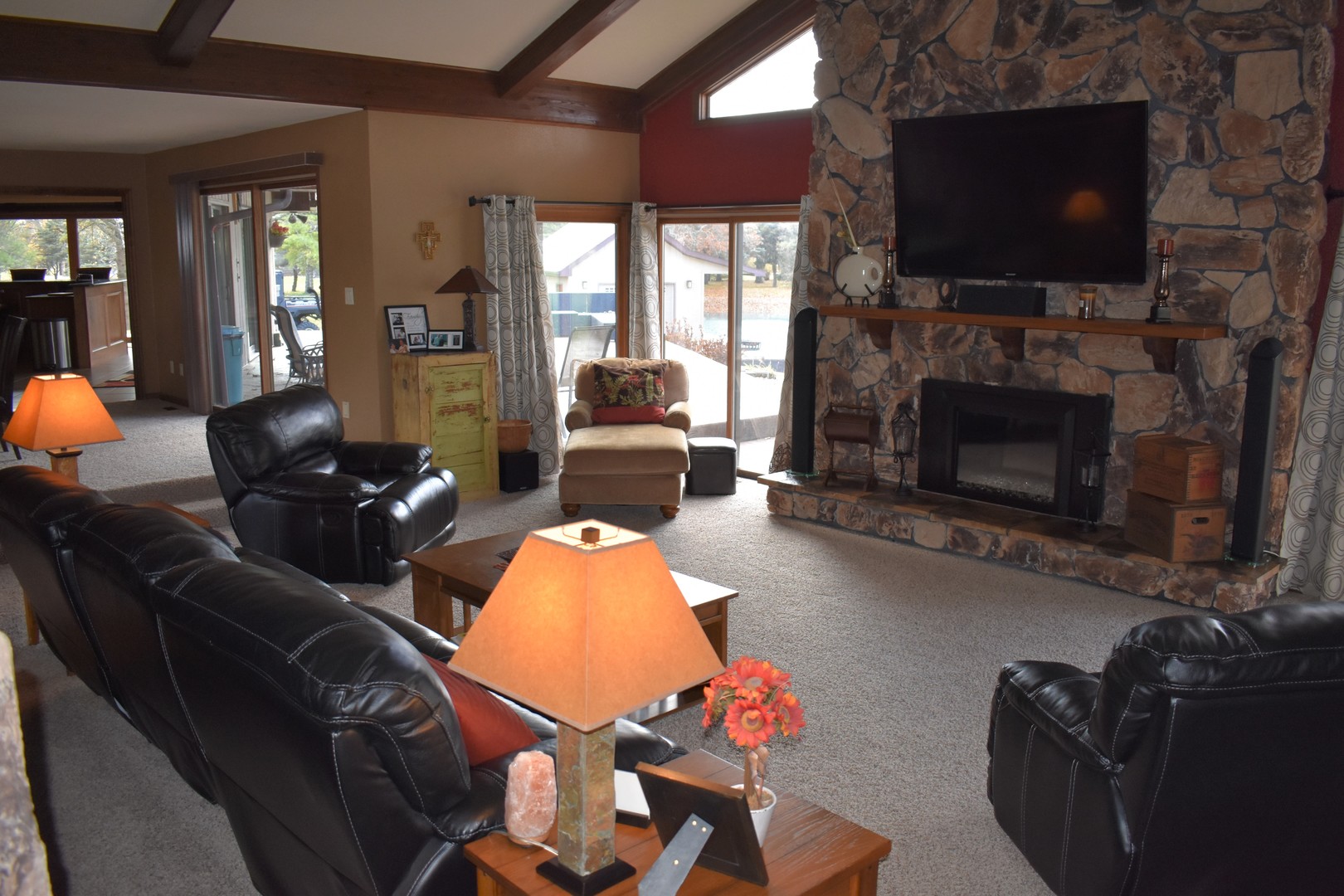 1413 East 550th Road Lostant, IL 61334 - Photo 20 of 37 a living room with furniture a flat screen tv and a fireplace