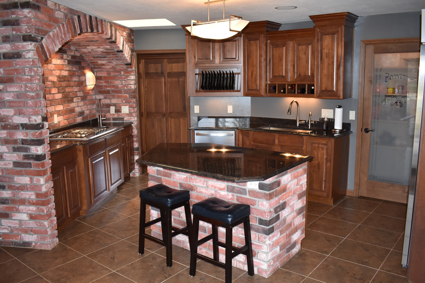 1413 East 550th Road Lostant, IL 61334 - Photo 21 of 37 a kitchen with a stove a sink and a refrigerator