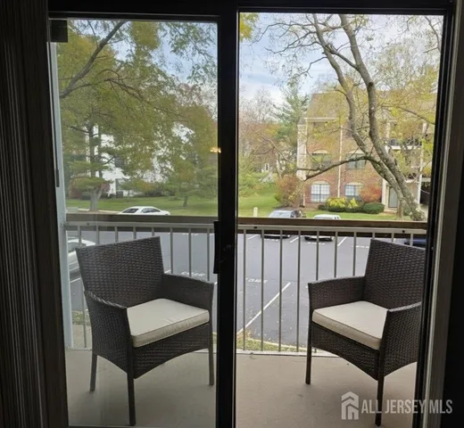 a view of a two chair in the balcony