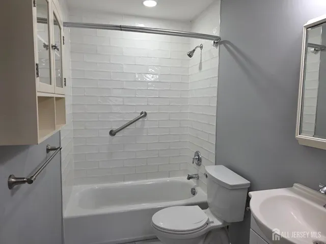 a bathroom with a toilet and a bathtub