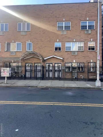 a front view of building with yard