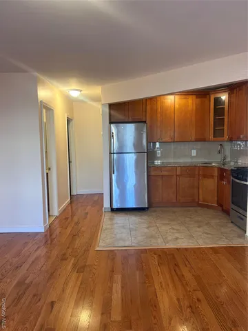 a view of a kitchen with a sink and cabinets