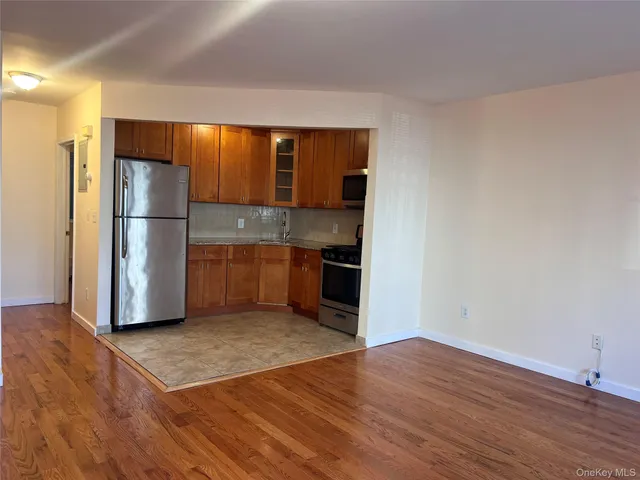 a kitchen with a refrigerator and a sink