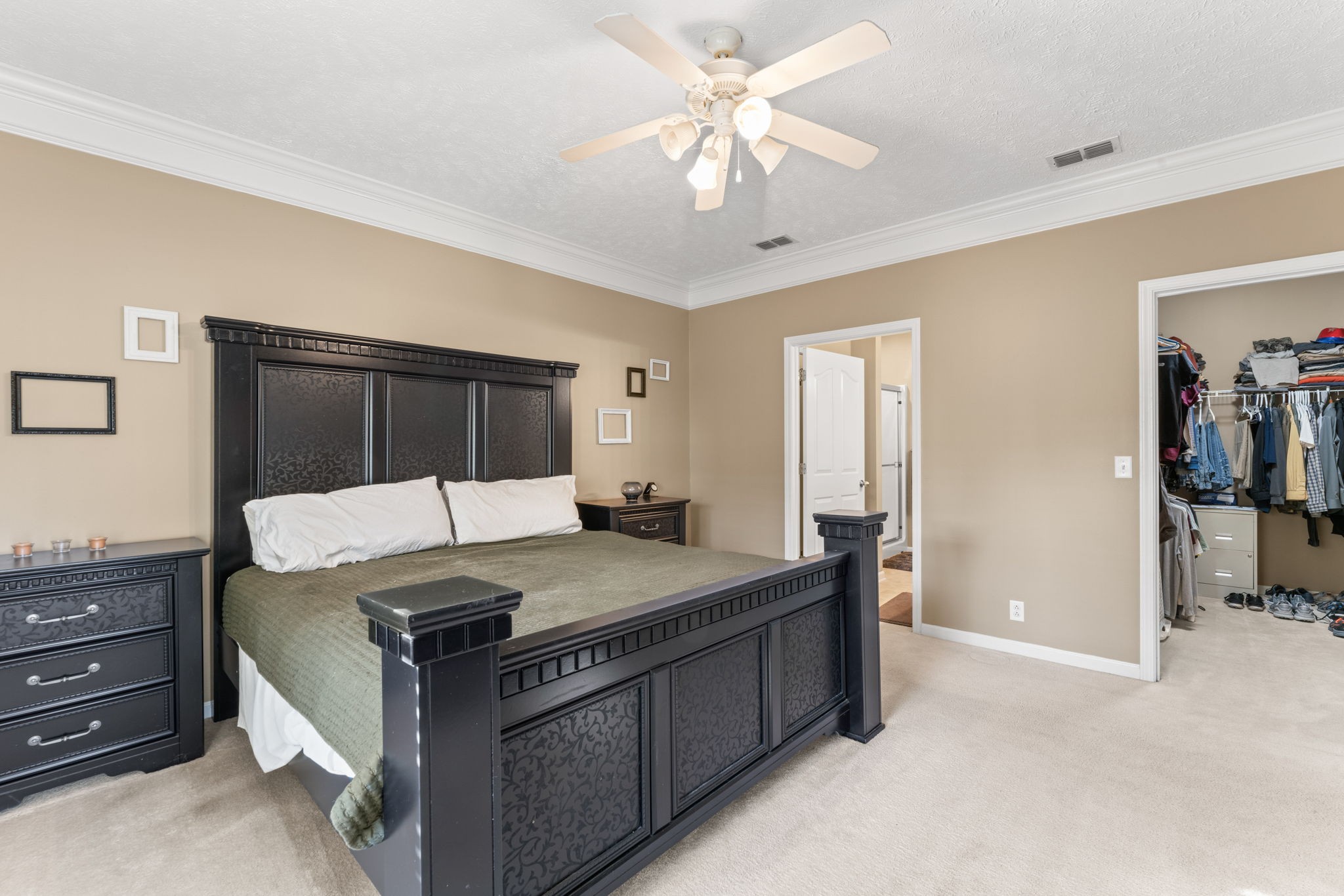 3339 Cotswold Lane Murfreesboro, TN 37128 - Photo 12 of 19 a spacious bedroom with a bed and a chandelier