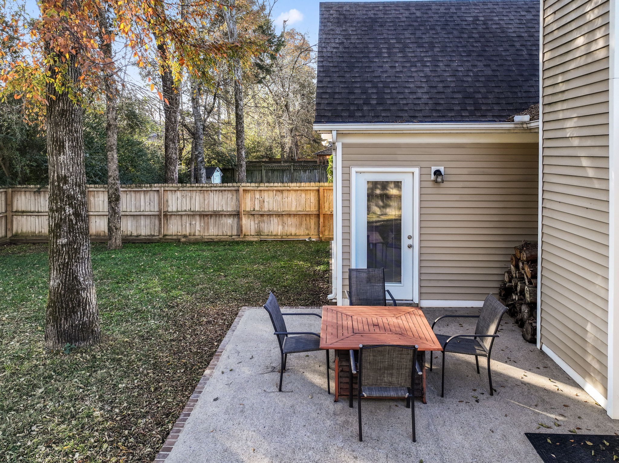 3339 Cotswold Lane Murfreesboro, TN 37128 - Photo 17 of 19 a view of a backyard with table and chairs potted plants and wooden fence