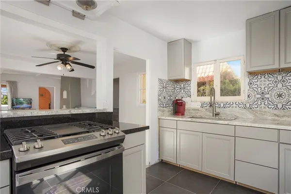 a kitchen with a stove and a sink