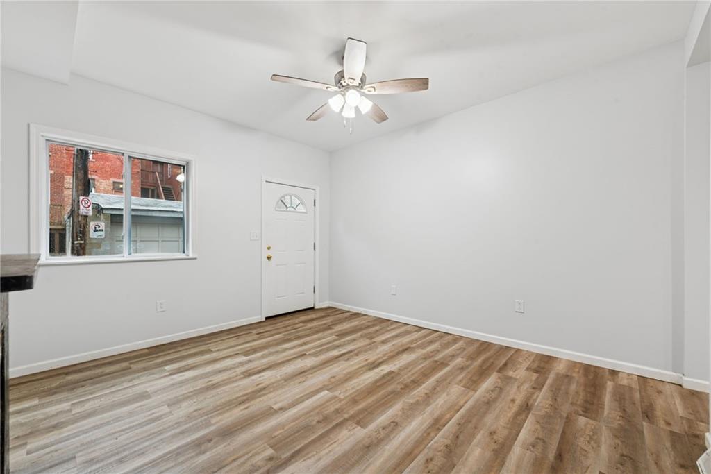 4416 Woolslayer Way Pittsburgh, PA 15224 - Photo 2 of 21 a view of an empty room with wooden floor