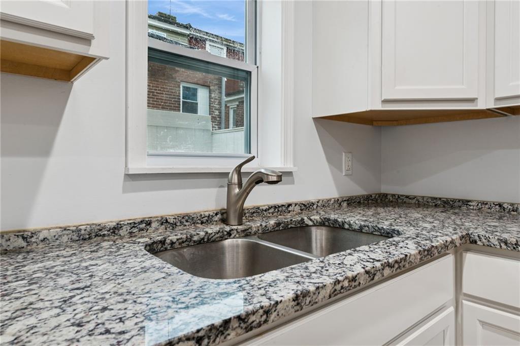 4416 Woolslayer Way Pittsburgh, PA 15224 - Photo 8 of 21 a kitchen with a sink and a window