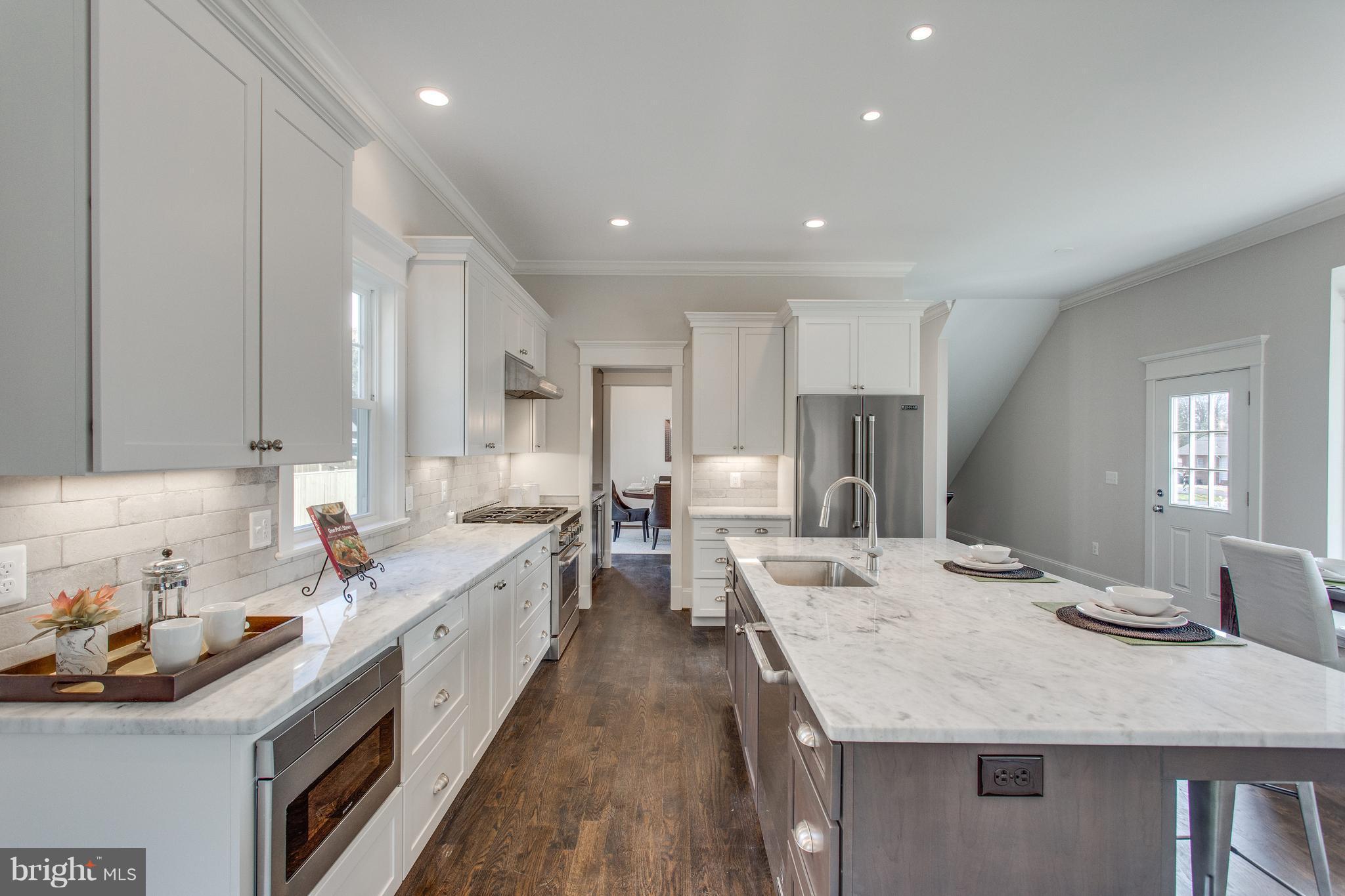 8111 Wellington Road Alexandria, VA 22308 - Photo 10 of 30 Quartzite countertops and island w breakfast bar