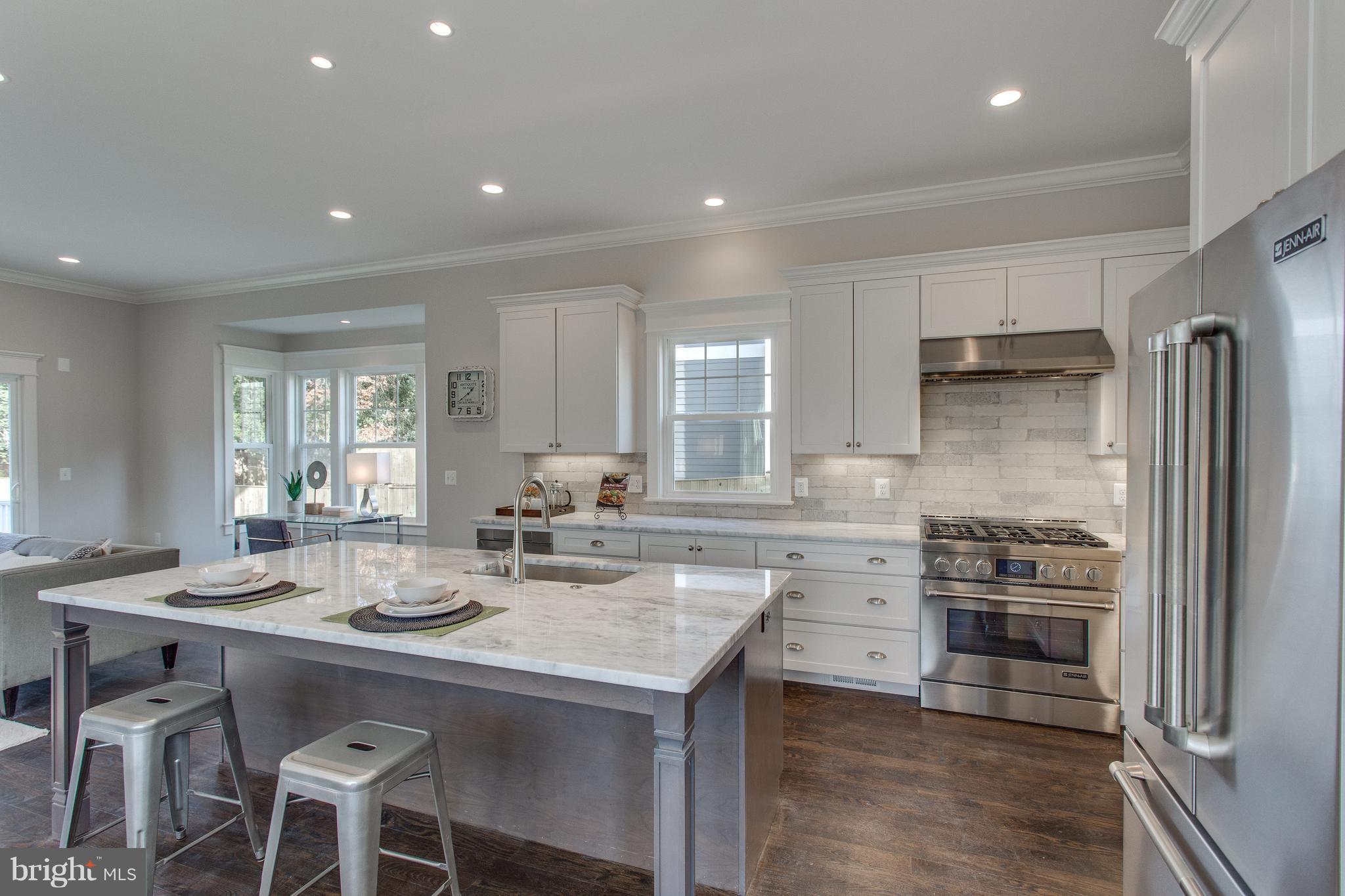 8111 Wellington Road Alexandria, VA 22308 - Photo 12 of 30 White and grey kitchen and solid oak floors