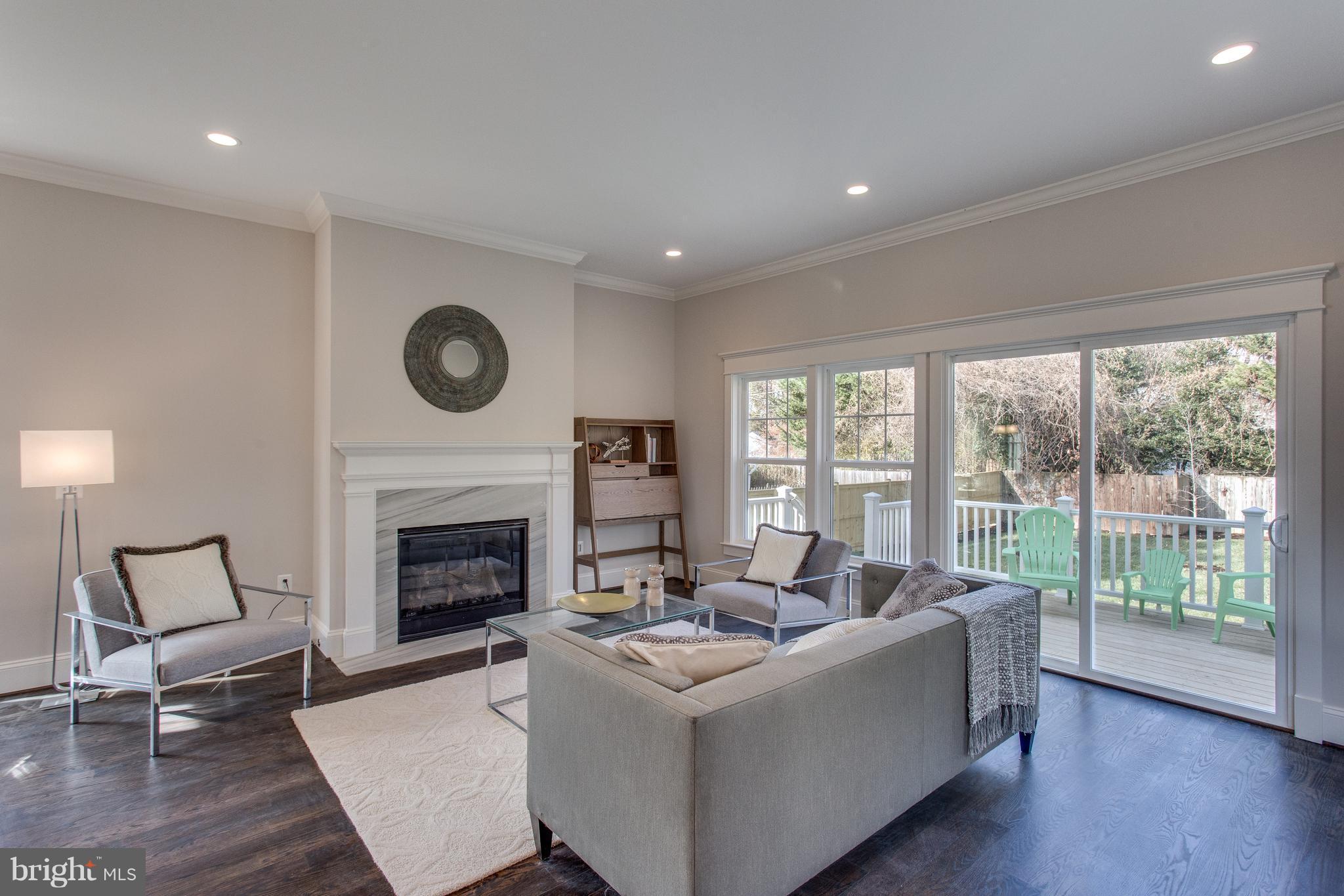 8111 Wellington Road Alexandria, VA 22308 - Photo 13 of 30 Gas fireplace with custom wood-crafted mantel