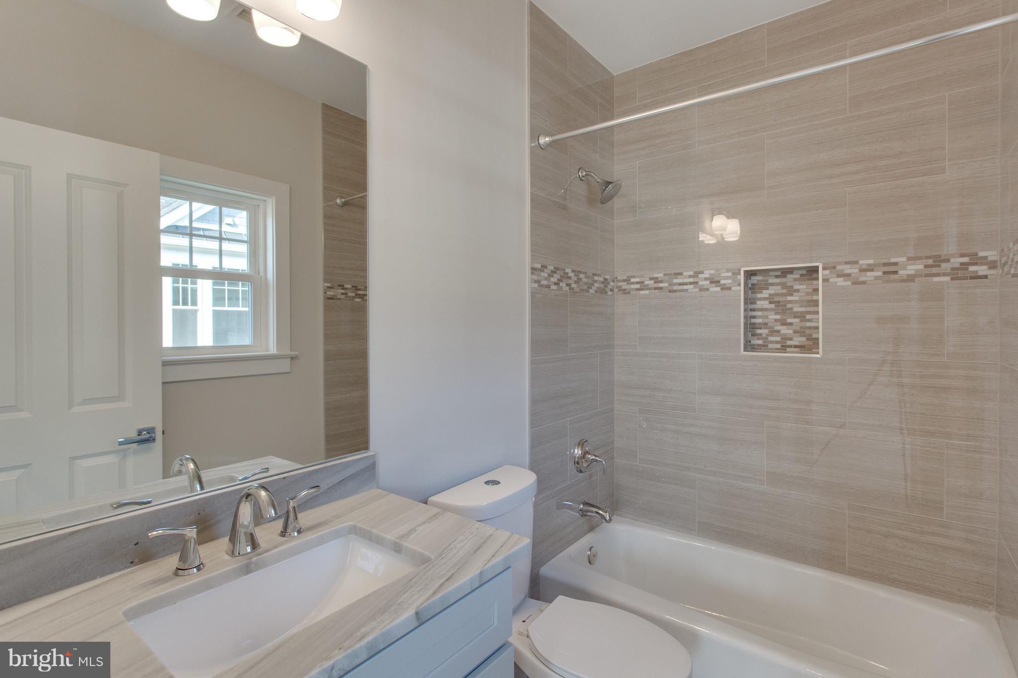 8111 Wellington Road Alexandria, VA 22308 - Photo 18 of 30 First bedroom features an en-suite bath