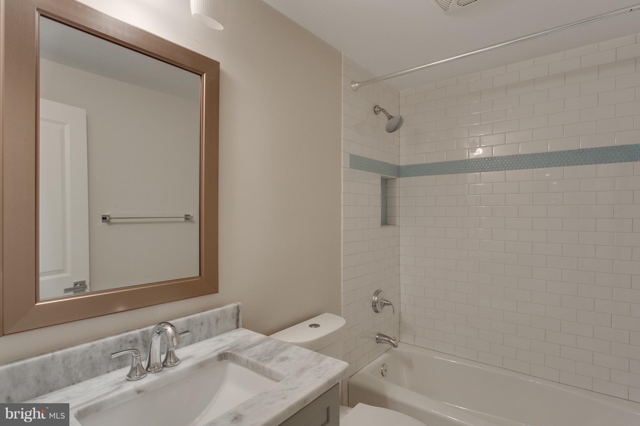 8111 Wellington Road Alexandria, VA 22308 - Photo 25 of 30 Full bath with tub shower on lower level