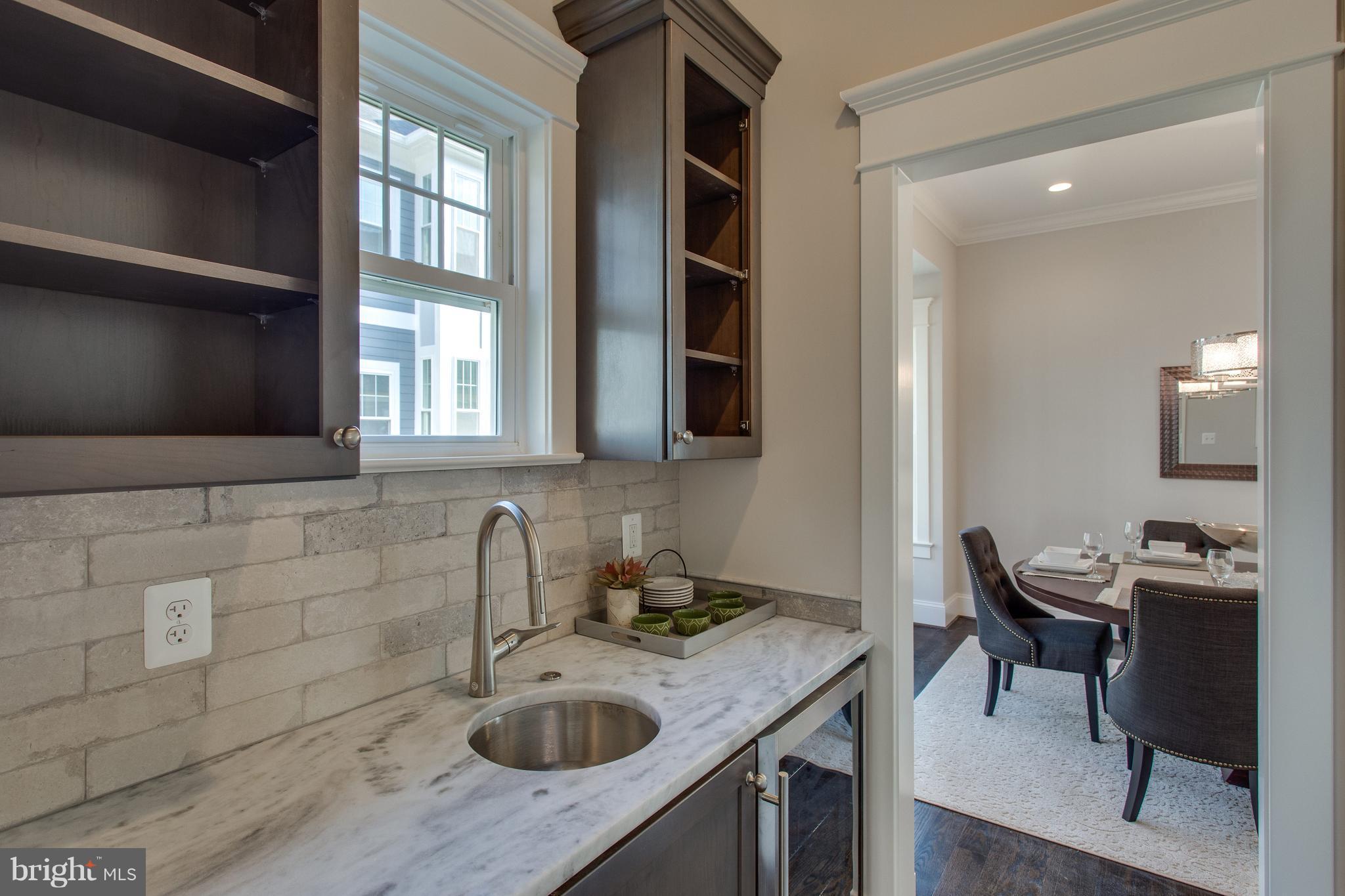 8111 Wellington Road Alexandria, VA 22308 - Photo 8 of 30 Quartzite-topped wet bar and huge pantry