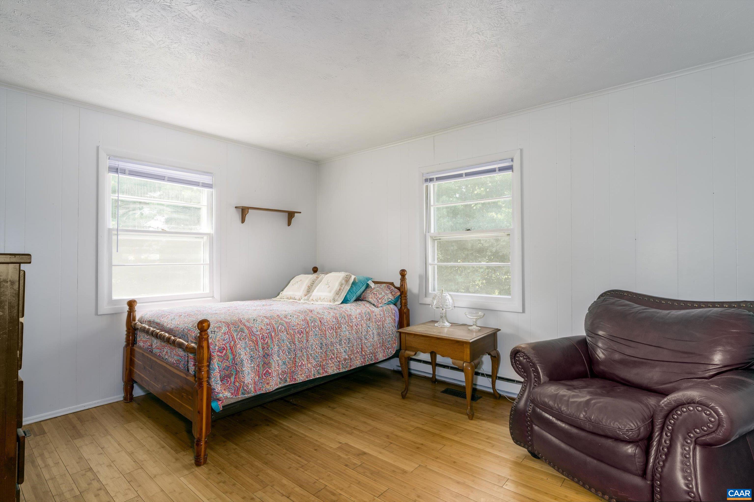 579 Miller Mountain Road Stanardsville, VA 22973 - Photo 11 of 27 a bedroom with a bed and a window