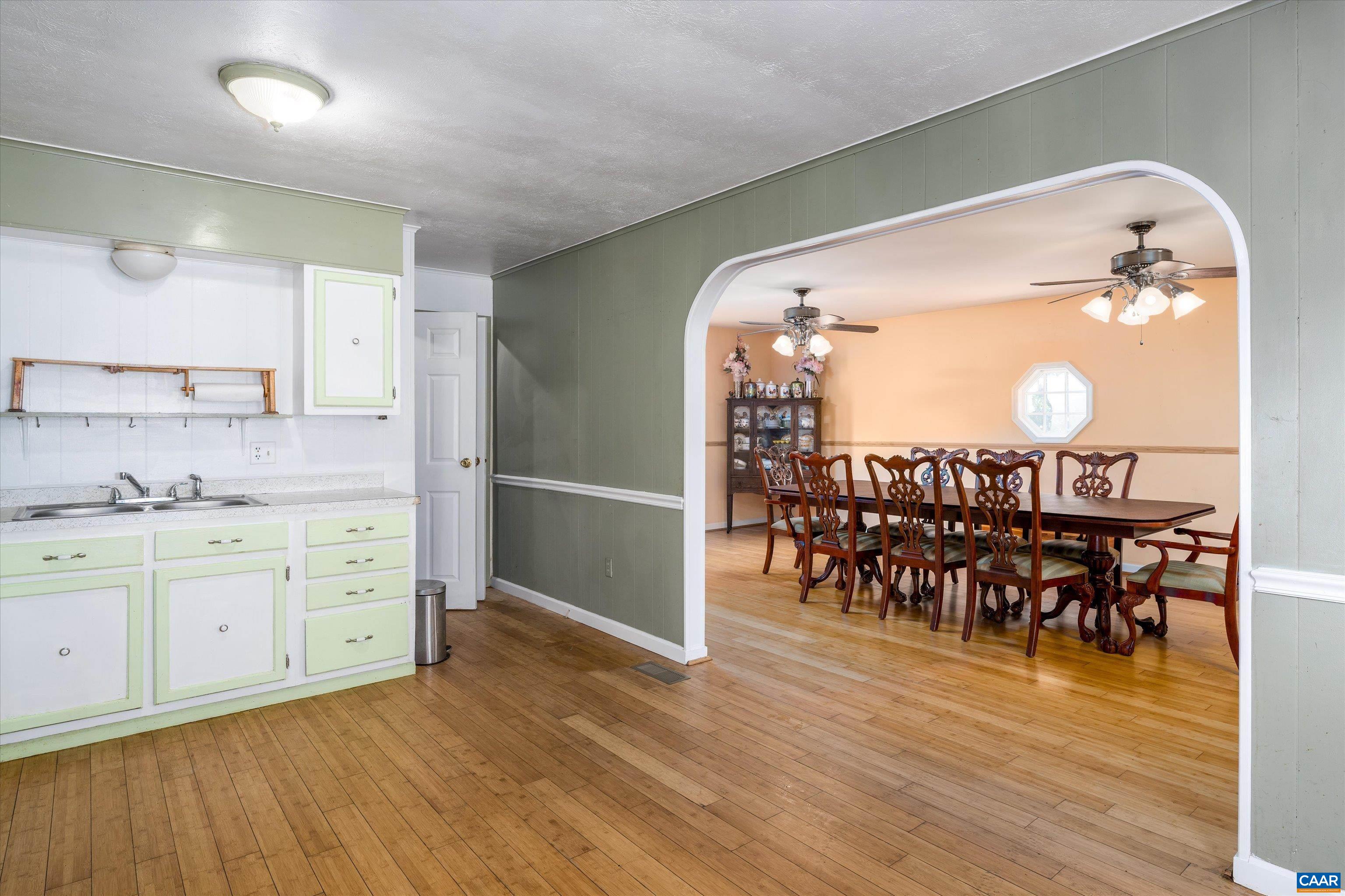 579 Miller Mountain Road Stanardsville, VA 22973 - Photo 5 of 27 a very nice looking dining room with kitchen island wooden floor and stainless steel appliances