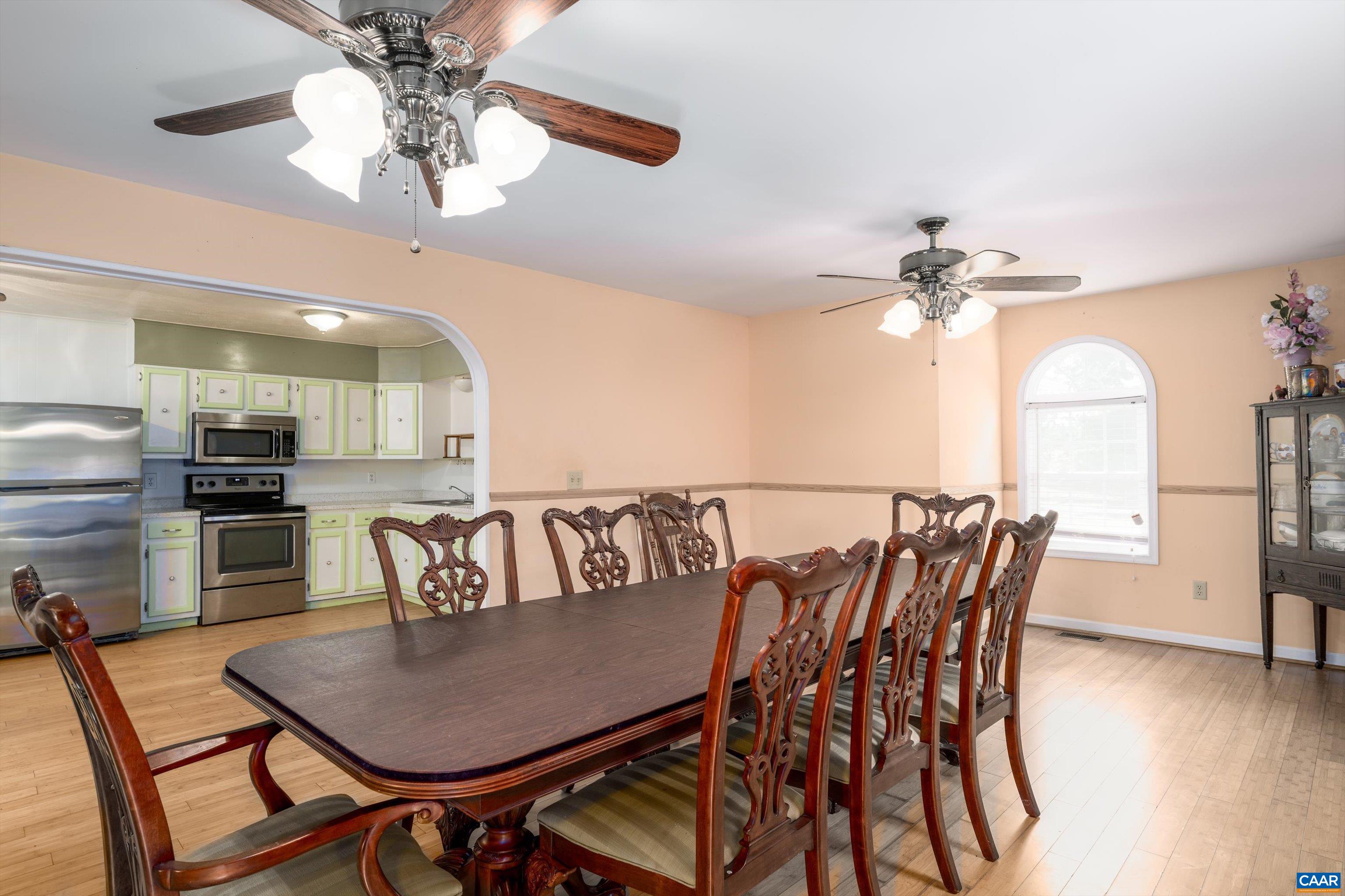 579 Miller Mountain Road Stanardsville, VA 22973 - Photo 6 of 27 a view of a dining room with furniture and wooden floor