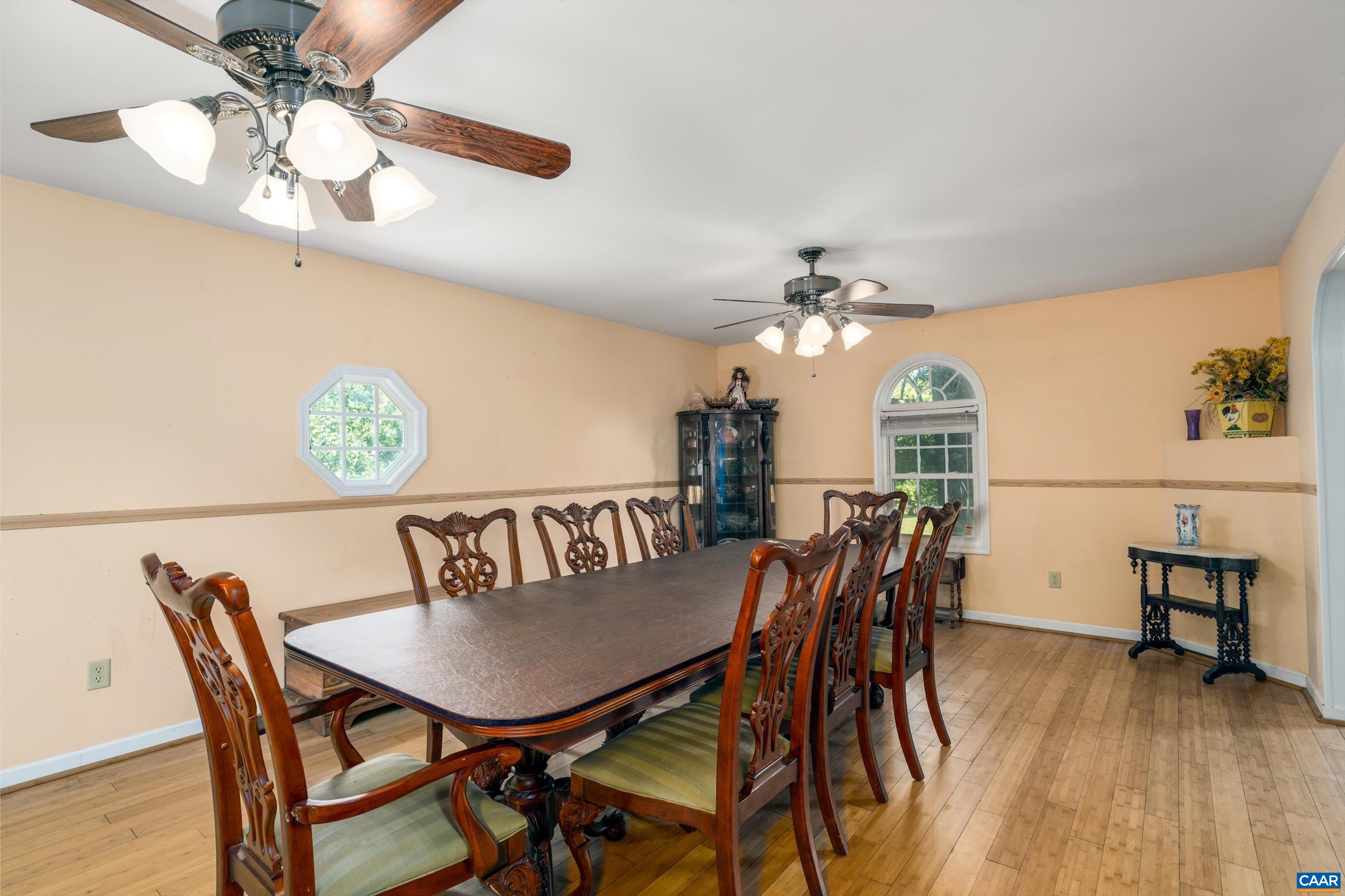 579 Miller Mountain Road Stanardsville, VA 22973 - Photo 7 of 27 a view of a dining room with furniture and wooden floor