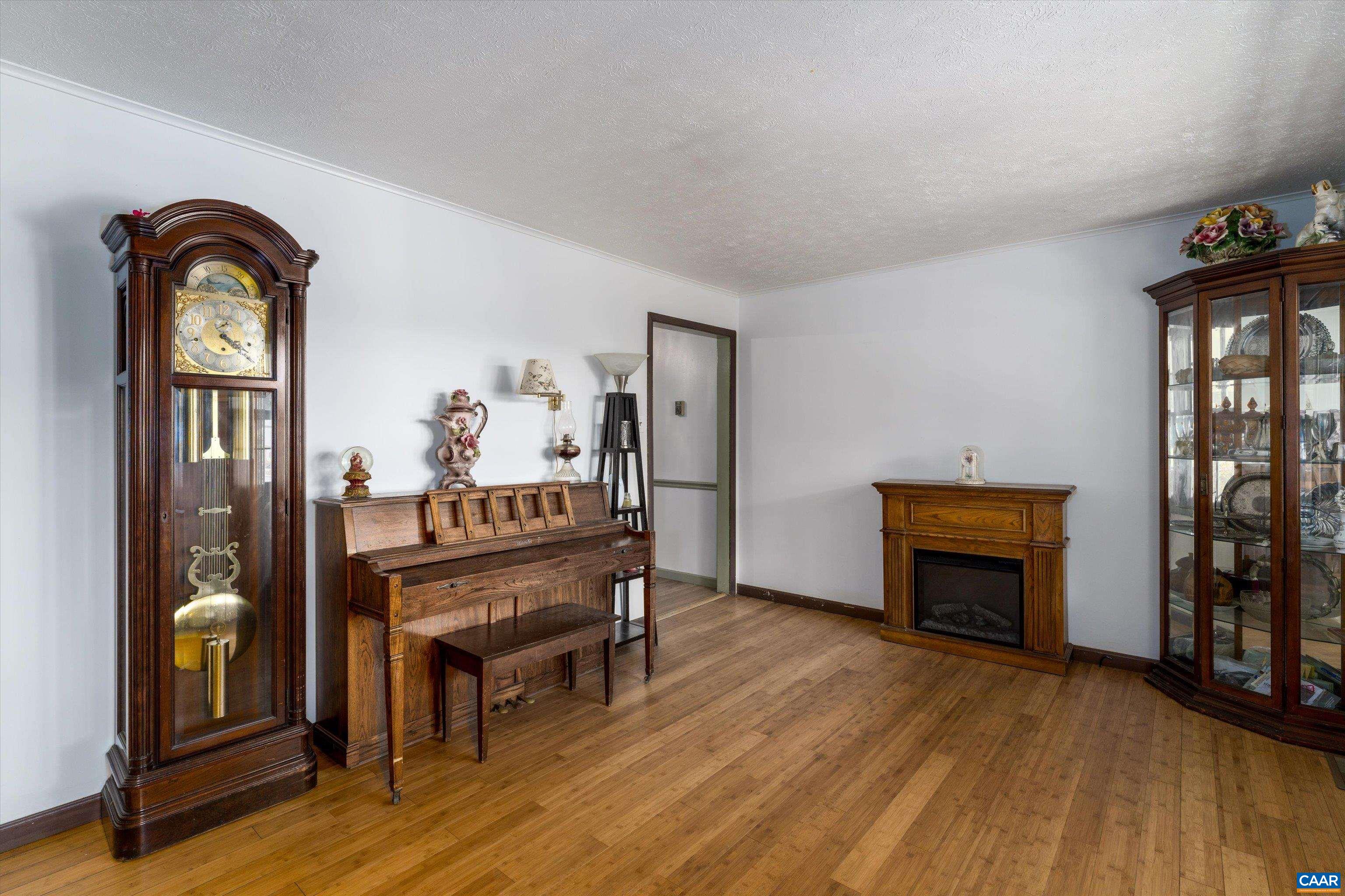 579 Miller Mountain Road Stanardsville, VA 22973 - Photo 9 of 27 a view of a livingroom with furniture and a fireplace