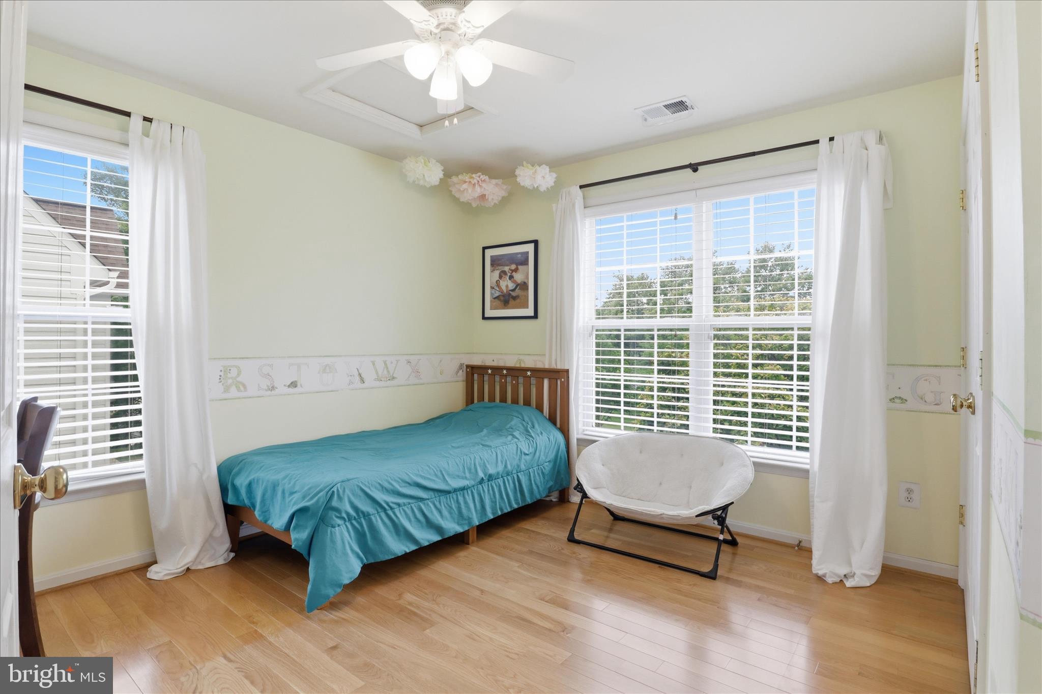 25352 Ripleys Field Drive Chantilly, VA 20152 - Photo 22 of 54 a living room with a bed and a chandelier