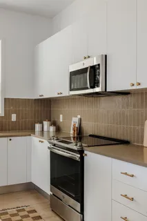 a kitchen with a sink and cabinets